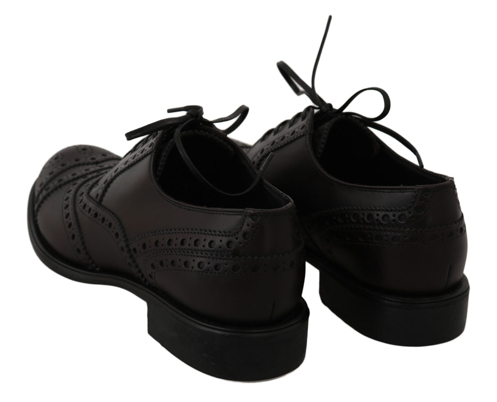 Chaussures Oxford en cuir noir Dolce & Gabbana avec détails wingtip, style élégant pour homme.