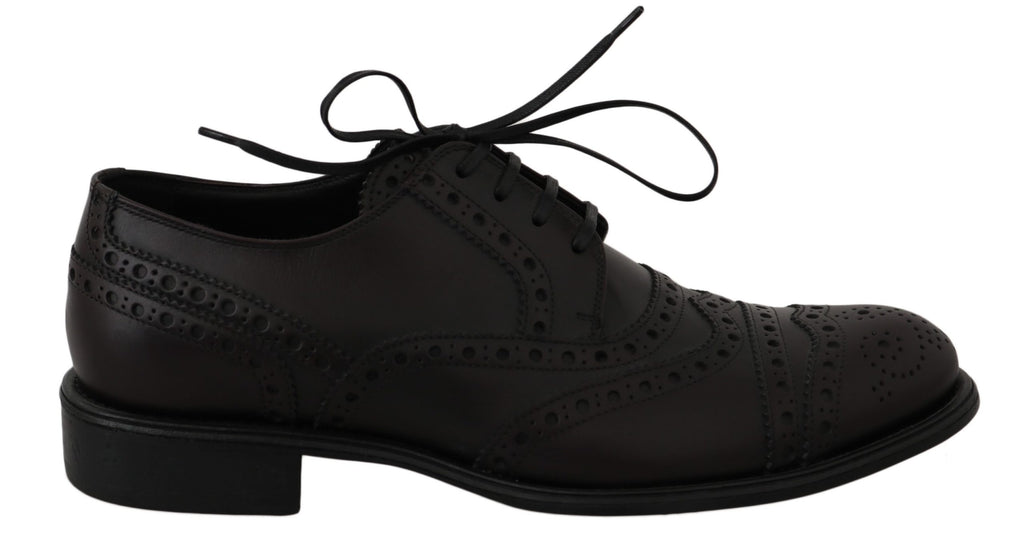 Chaussures habillées en cuir noir Dolce & Gabbana, derby wingtip Oxford élégantes pour homme, vue de face.