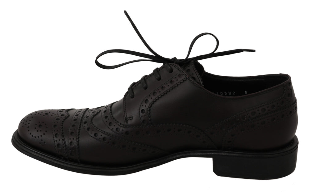 Chaussures oxford en cuir noir Dolce & Gabbana pour homme, design wingtip élégant et sophistiqué.