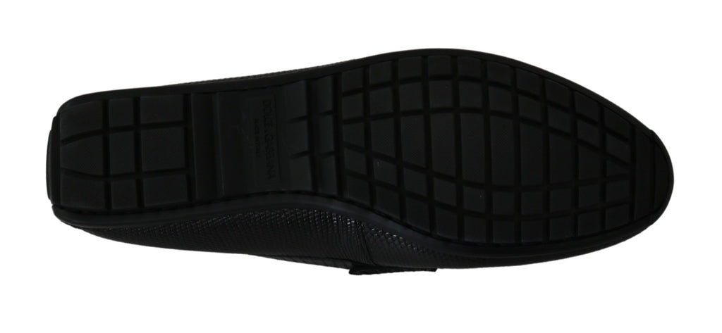 Chaussures mocassins plats en cuir de lézard noir de Dolce & Gabbana, élégantes et sophistiquées, vues en gros plan.
