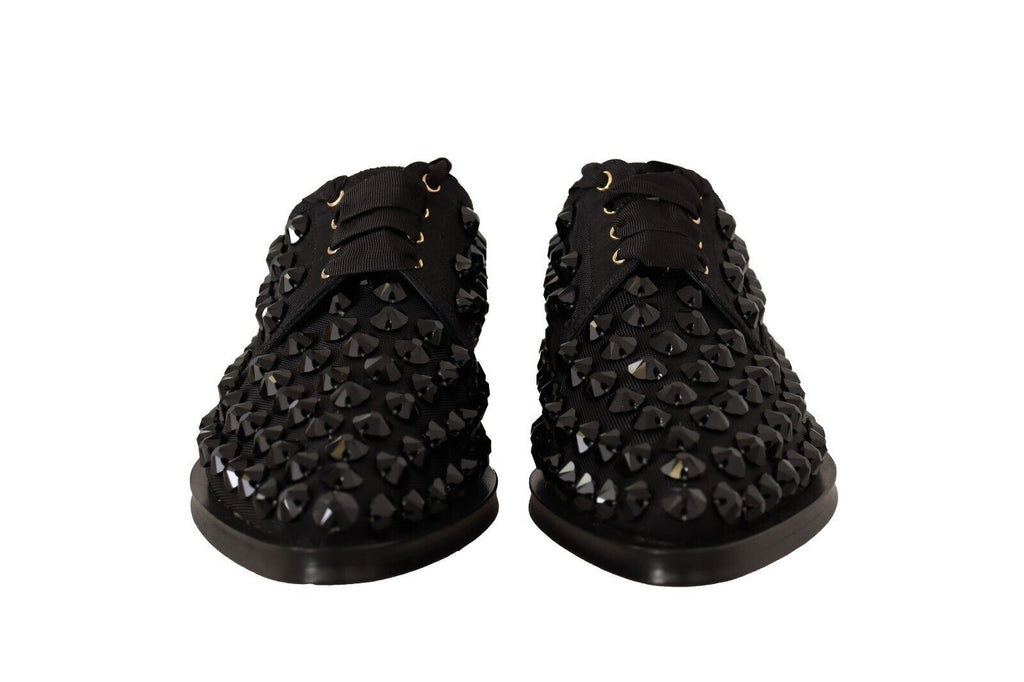 Chaussures plates noires Dolce & Gabbana, ballerines formelles à lacets et clous, avec détails en dentelle et style élégant.