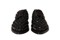Chaussures plates noires Dolce & Gabbana, ballerines formelles à lacets et clous, avec détails en dentelle et style élégant.