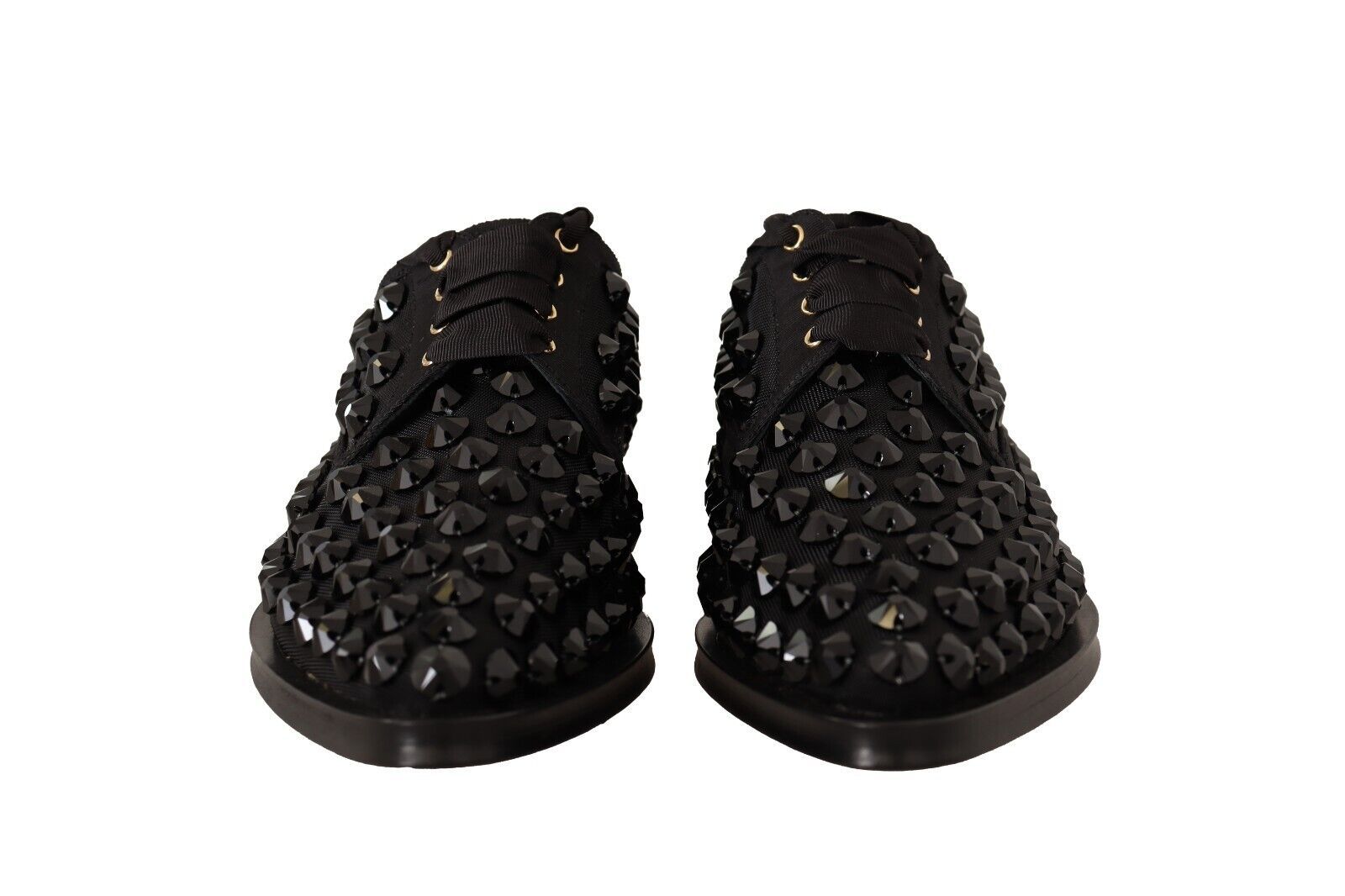 Chaussures plates noires Dolce & Gabbana, ballerines formelles à lacets et clous, avec détails en dentelle et style élégant.