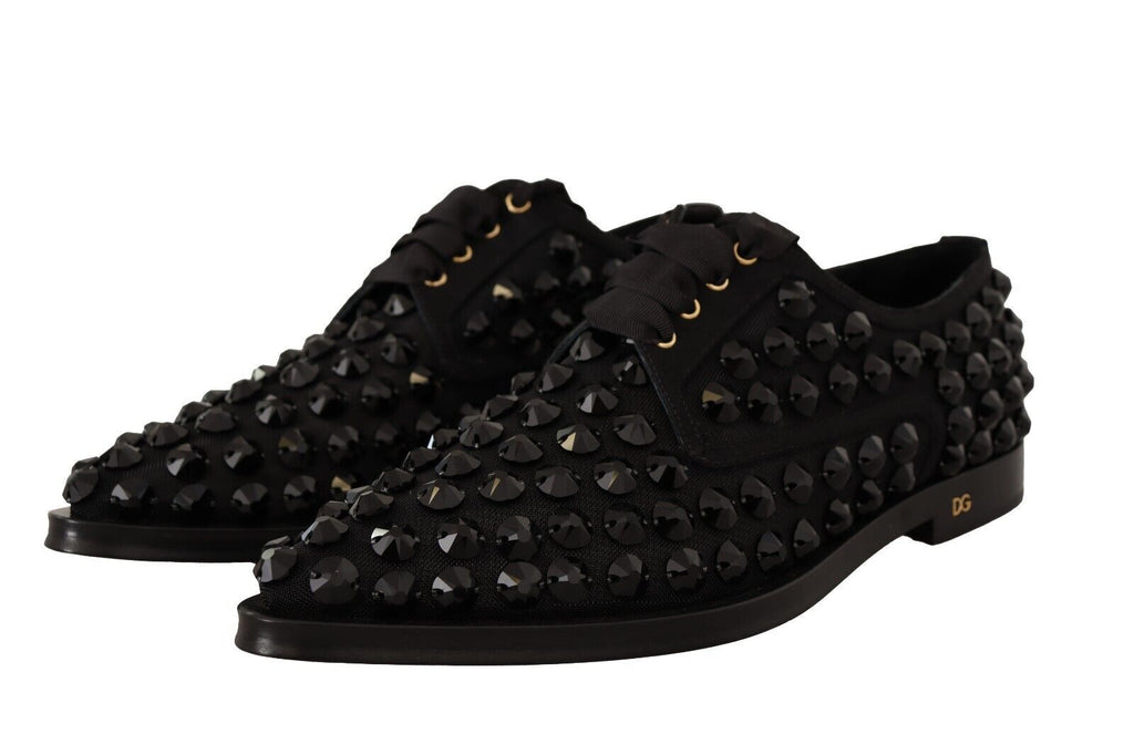 Chaussures plates formelles Dolce & Gabbana noires avec lacets en dentelle et clous, style élégant et sophistiqué.