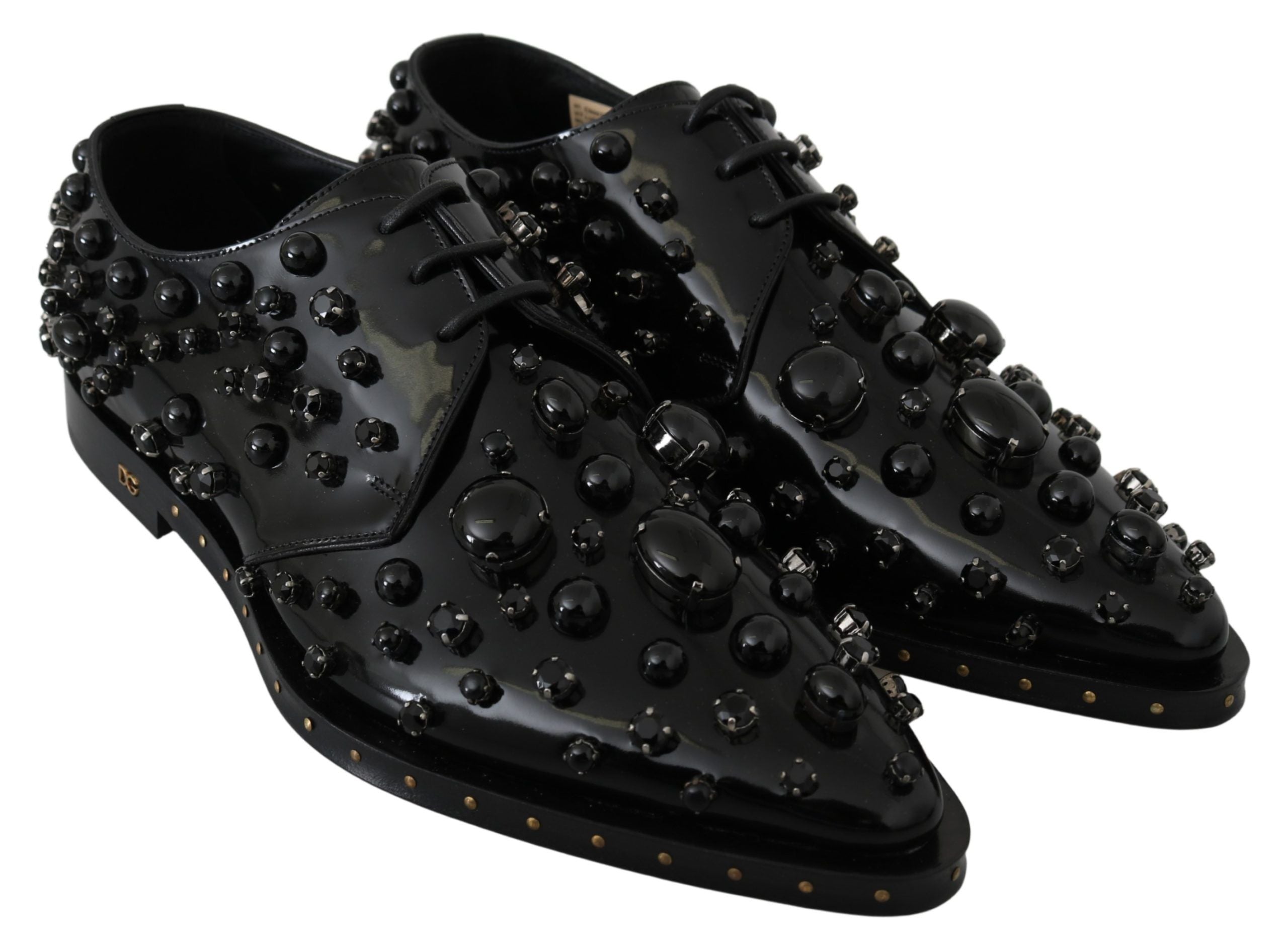 Chaussures brogue en cuir noir Dolce & Gabbana avec cristaux, élégantes et détaillées, visibles en gros plan.