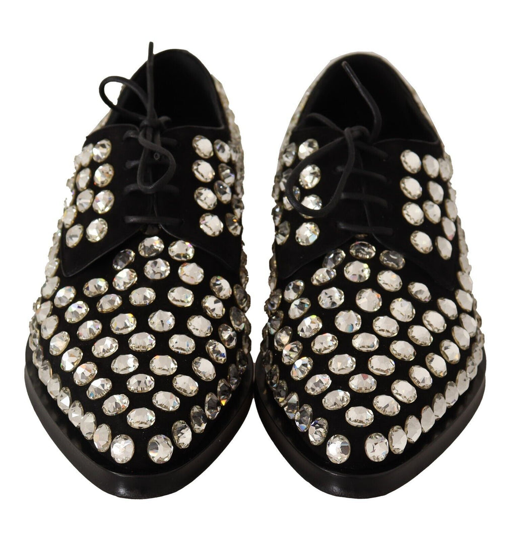 Chaussures formelles en cuir noir avec cristaux et lacets de la marque Dolce & Gabbana, visibles sur l'image.