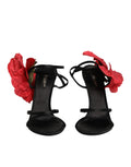 Sandales à talons noires Dolce & Gabbana en cuir avec lanières et motifs floraux, vues de côté.