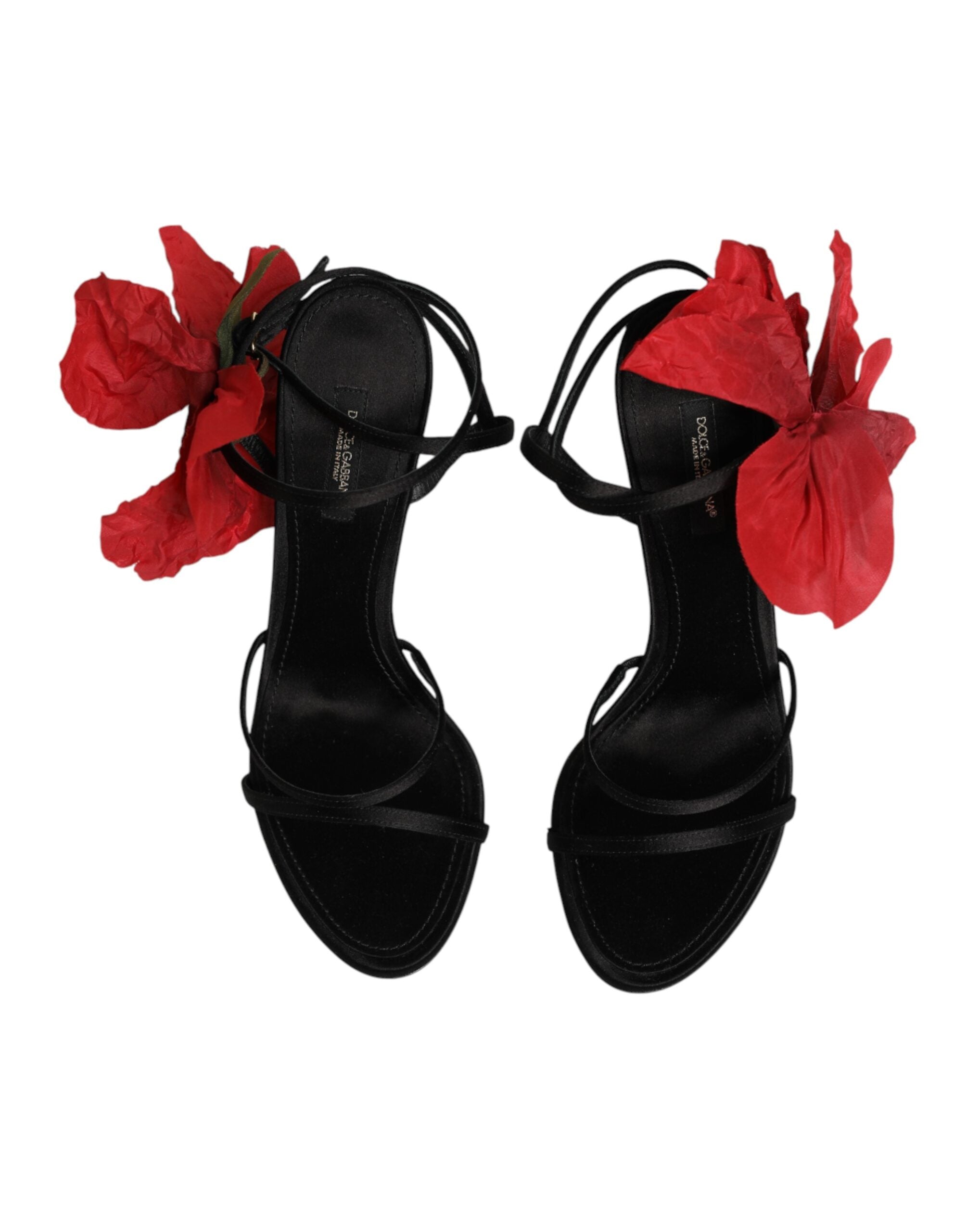 Sandales à talons noires en cuir avec lanières et motifs floraux de Dolce & Gabbana, vues de côté.