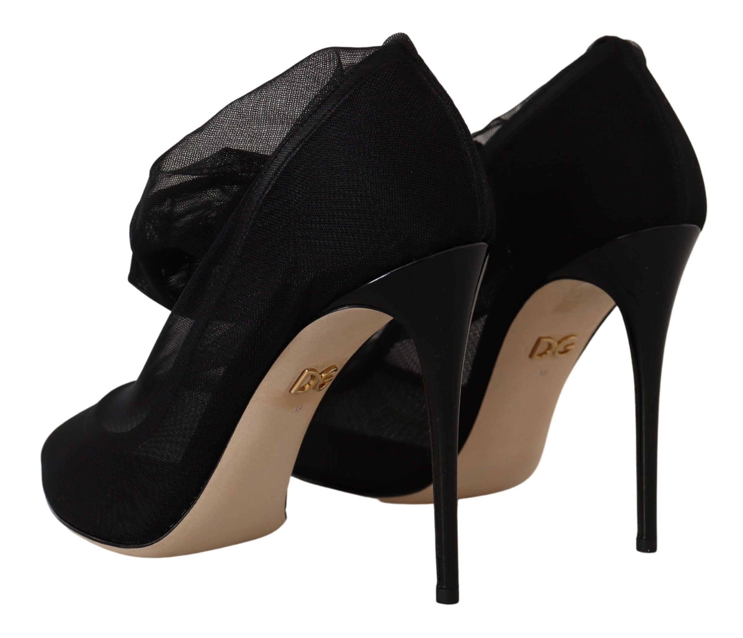 Chaussures noires Dolce & Gabbana en tulle extensible et bottes stretch élégantes, vue de face.