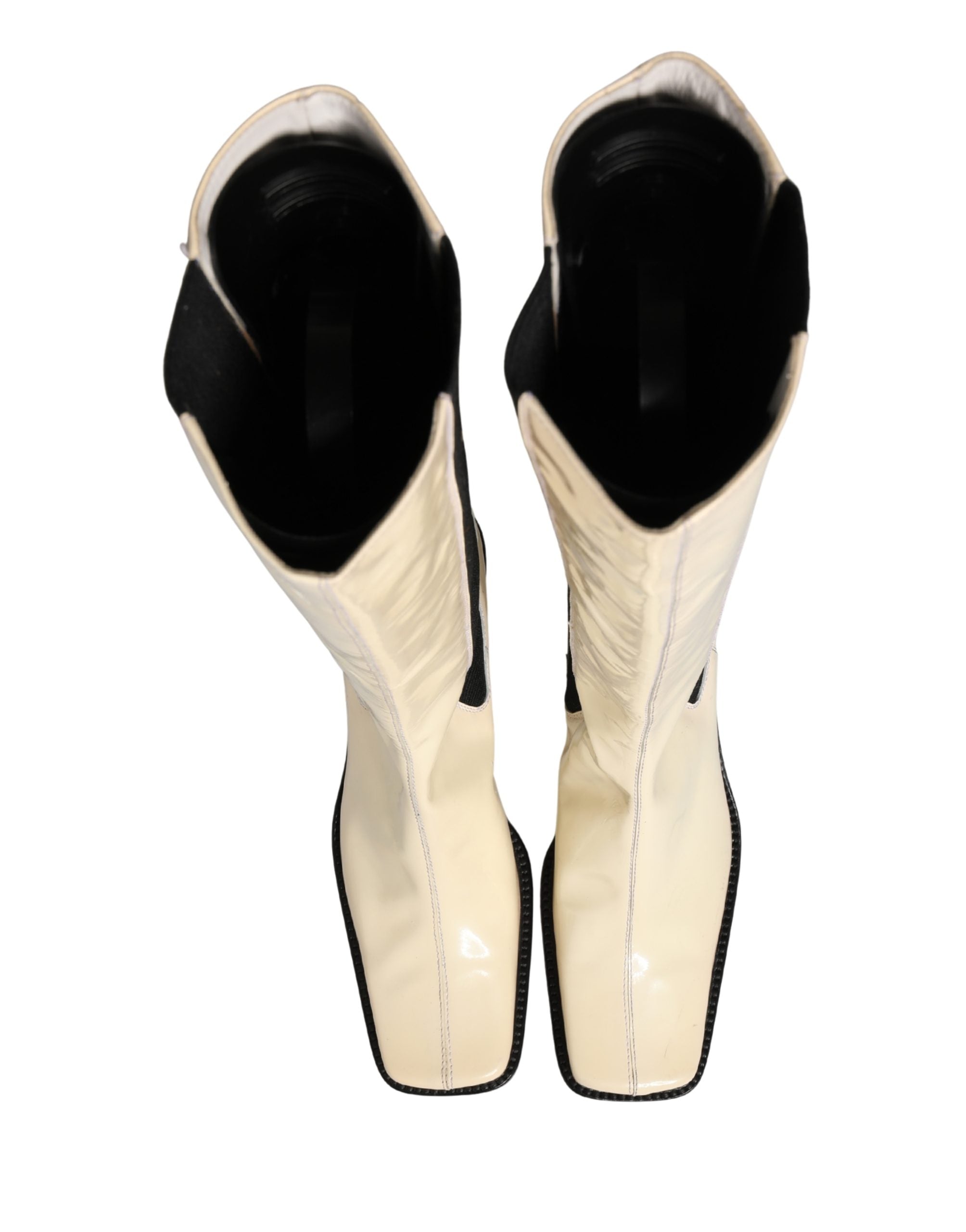 Bottes hautes en cuir blanc et noir de Dolce & Gabbana, chaussures élégantes en cuir pour femmes.