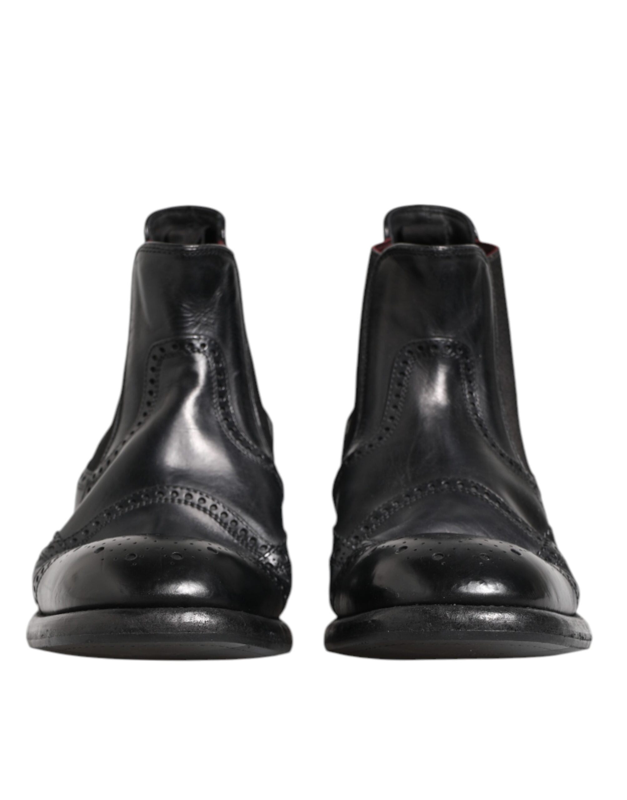 Chaussures bottines en cuir noir Dolce & Gabbana, style slip-on, pour femmes, vue de profil sur fond blanc.