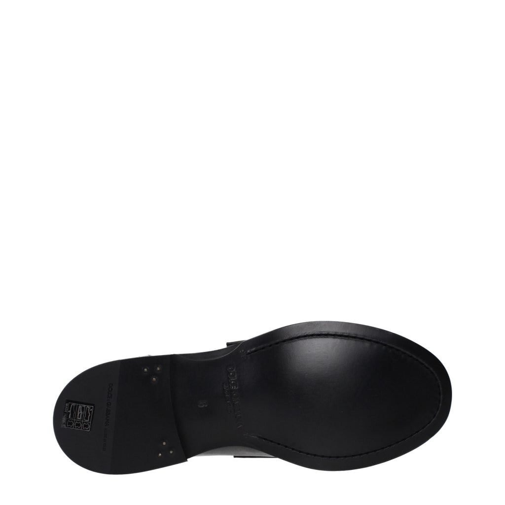 Mocassins noirs en cuir Dolce & Gabbana pour homme, style slip-on avec finition élégante et semelle en caoutchouc.