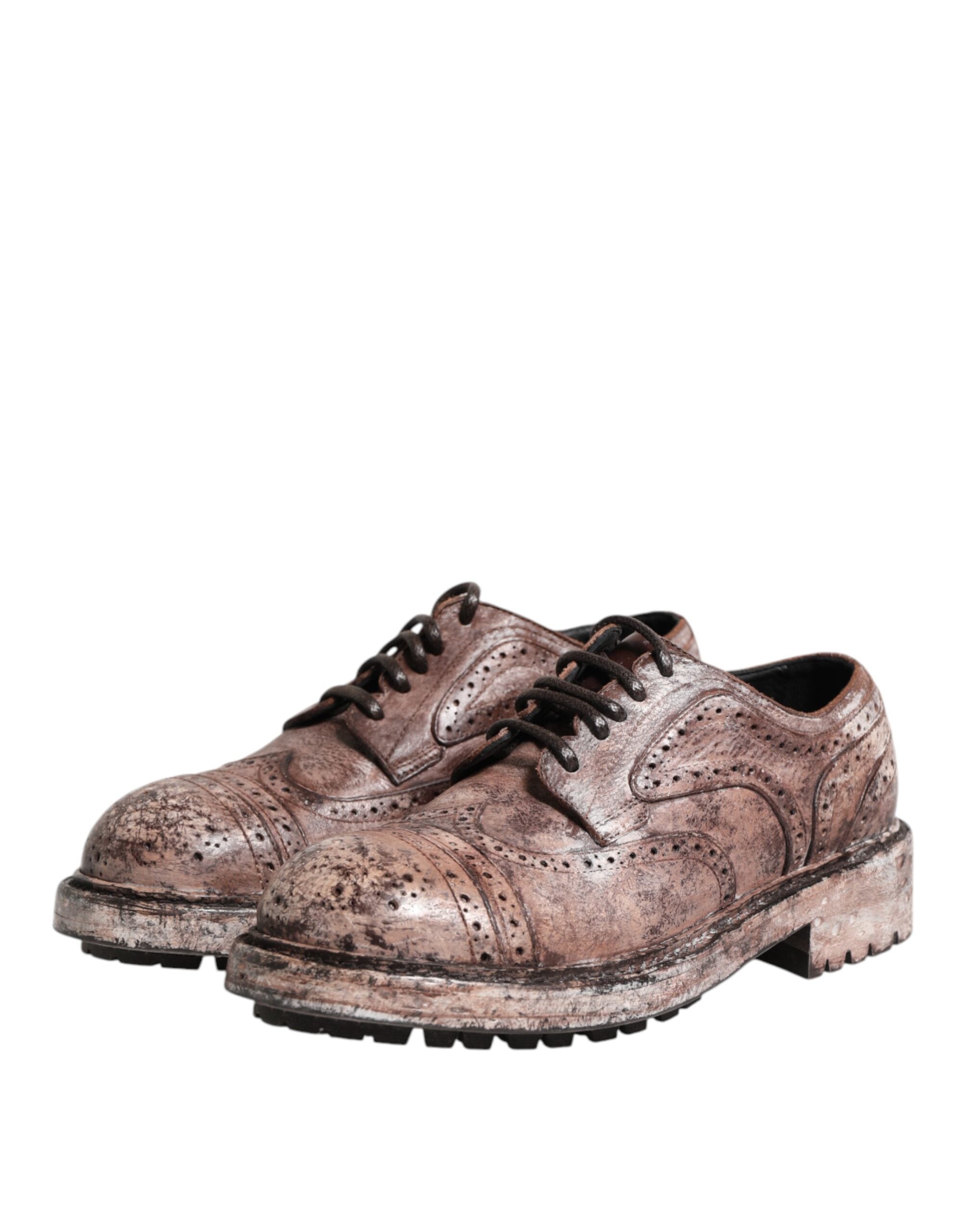 Chaussures brogue en cuir marron distressed de Dolce & Gabbana, à lacets, avec détails élégants et finition usée.