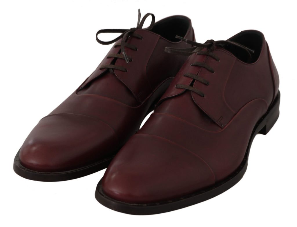 Chaussures Derby en cuir rouge Bordeaux de Dolce & Gabbana, chaussures formelles élégantes pour homme, vue de face.
