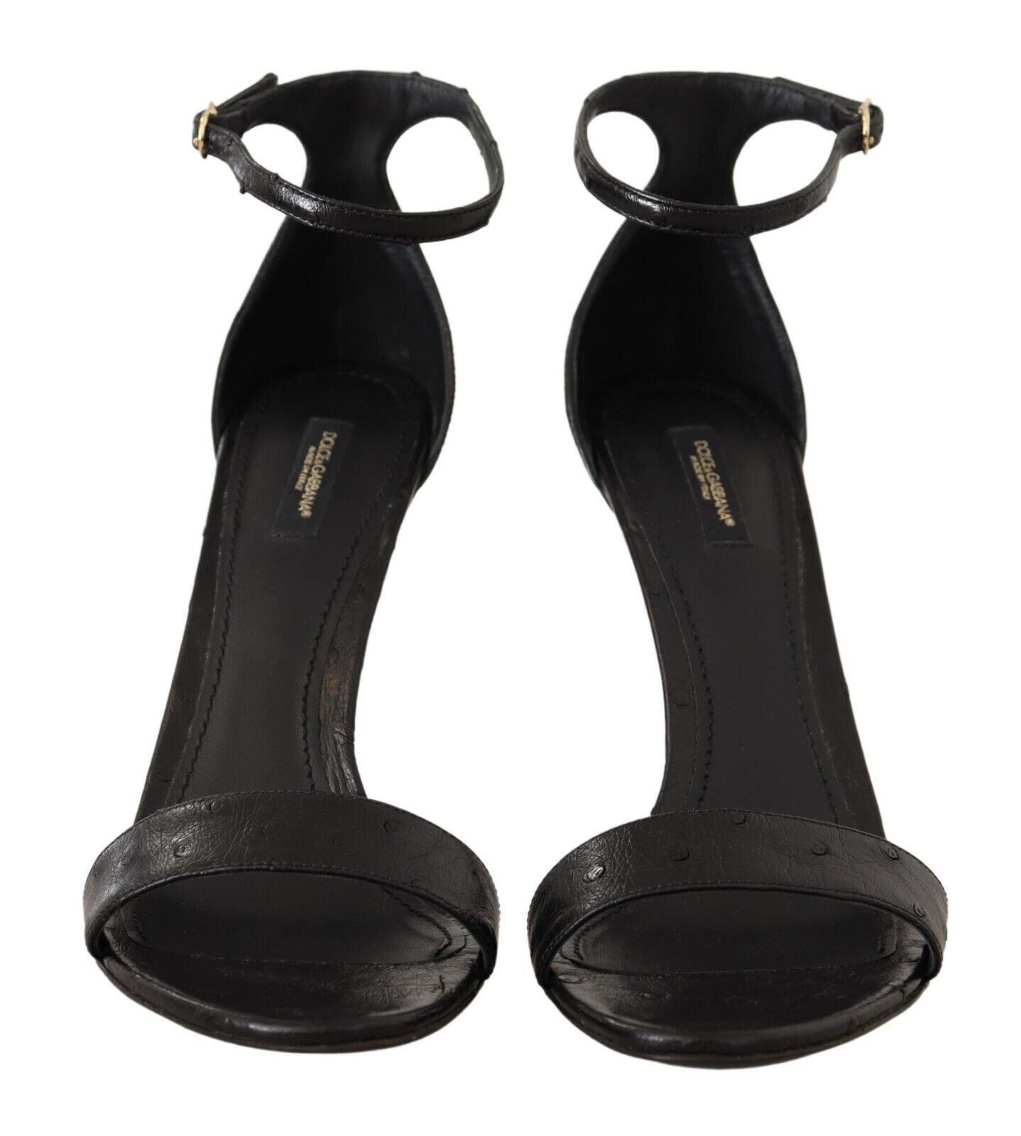 Sandales à talons Dolce & Gabbana en ostrich noir avec bride à la cheville, vue de profil sur fond blanc.