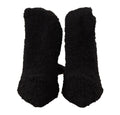 Chaussettes noires extensibles Dolce & Gabbana, portées avec bottines hautes, visibles en détail dans l'image.