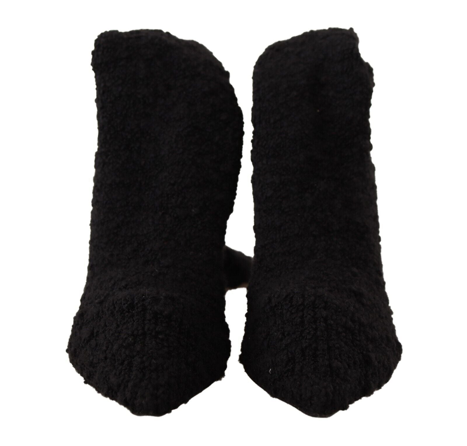 Chaussettes noires extensibles Dolce & Gabbana, portées avec bottines hautes, visibles en détail dans l'image.