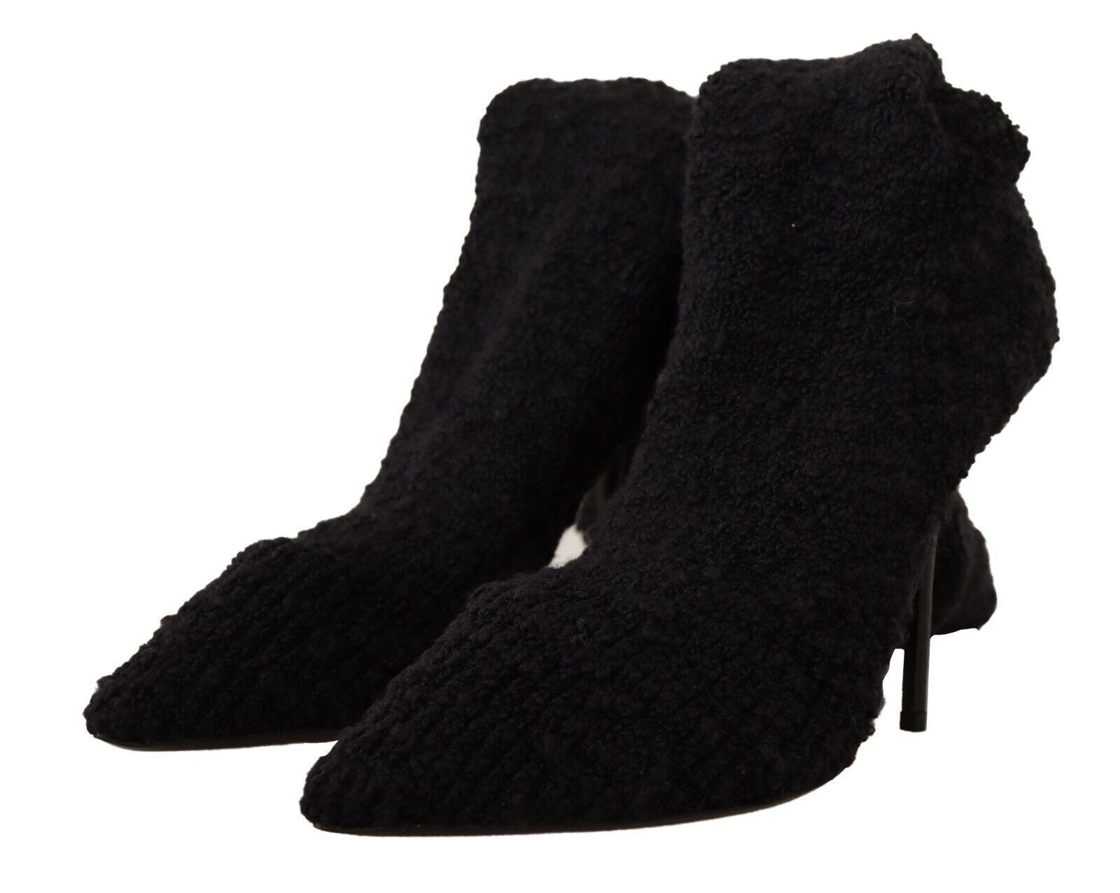 Chaussettes noires extensibles Dolce & Gabbana, portées avec des bottines hautes pour un look élégant et sophistiqué.