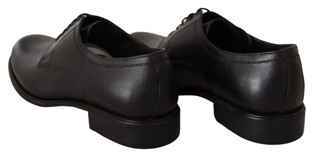 Chaussures derby noires en cuir pour homme de marque Dolce & Gabbana, lacets élégants et finition sophistiquée.