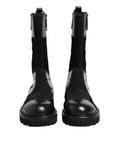 Bottes en cuir patchwork noir Dolce & Gabbana, mi-mollet, avec détails de couture élégants et semelle en caoutchouc.