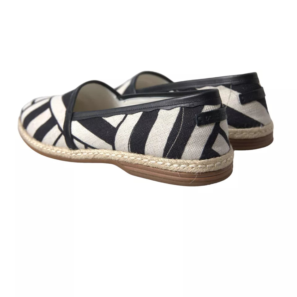 Chaussures espadrilles Dolce & Gabbana à rayures noires et blanches, slip-on, en toile avec semelle en corde.