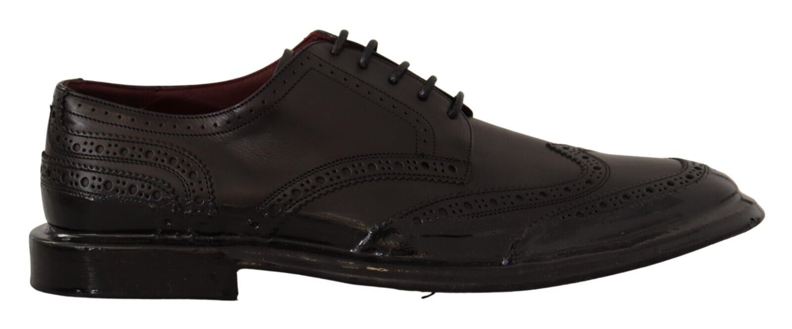 Chaussures Derby formelles en cuir noir Dolce & Gabbana avec détails wingtip et lacets, style élégant pour homme.