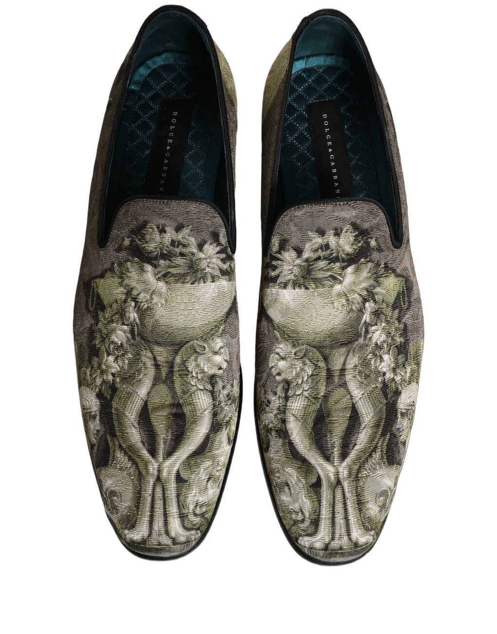 Chaussures Dolce & Gabbana loafers slip-on en cuir marron avec motif baroque, élégantes et confortables, pour un style sophistiqué.