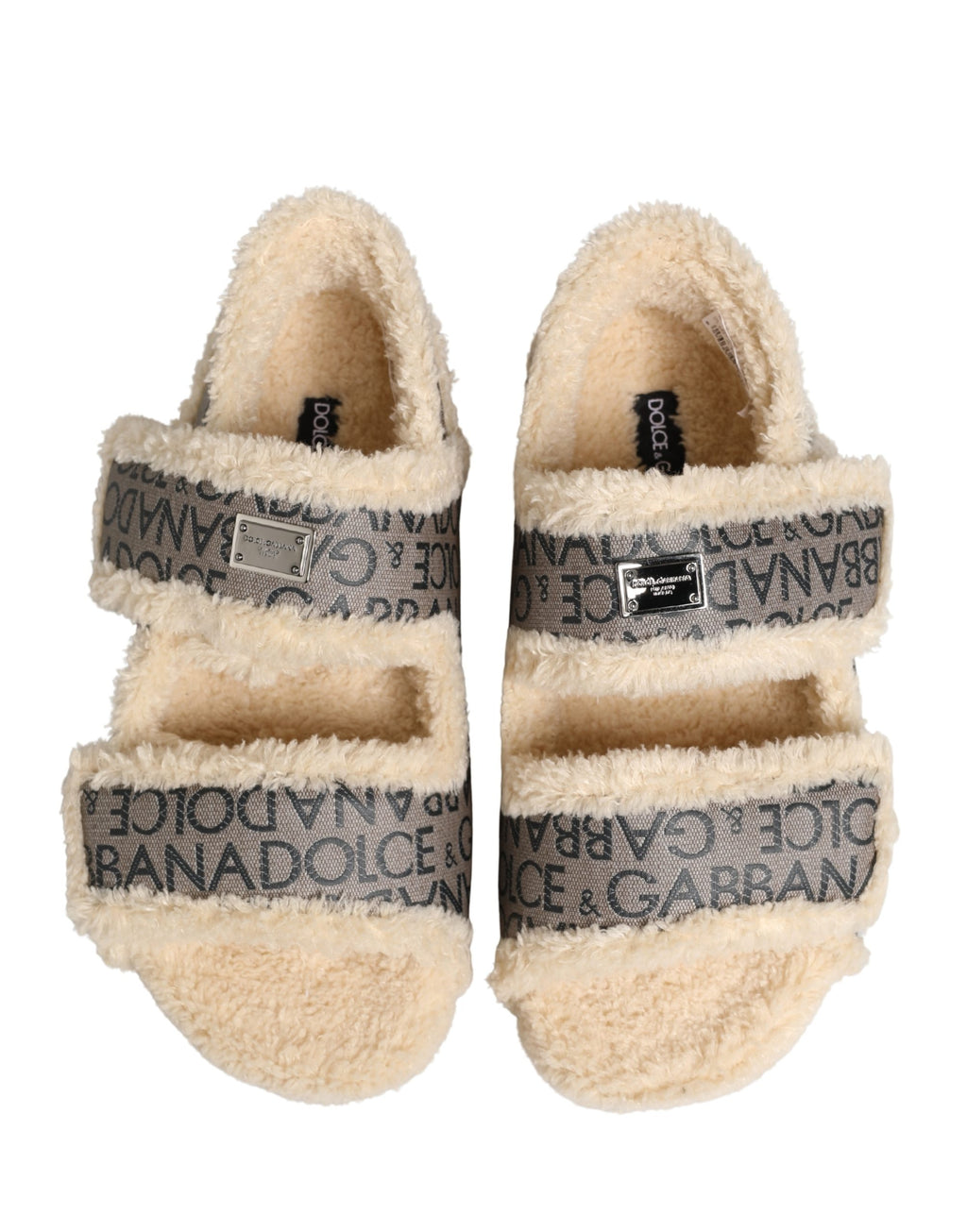 Sandales plates Dolce & Gabbana en fausse fourrure beige avec logo imprimé, confortables et élégantes, vues de dessus.