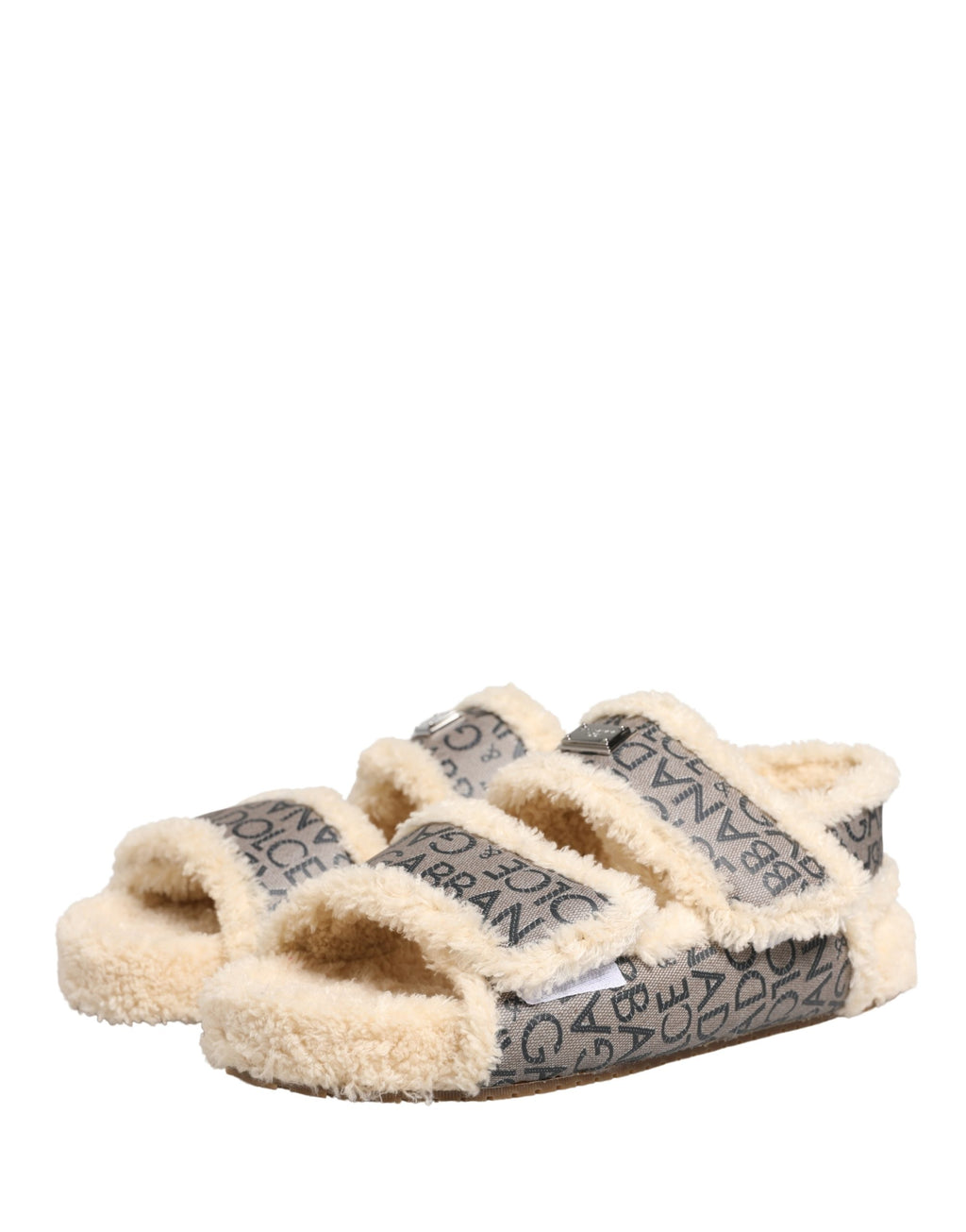 Sandales plates Dolce & Gabbana en fausse fourrure beige avec logo imprimé, élégantes et confortables pour l'été.