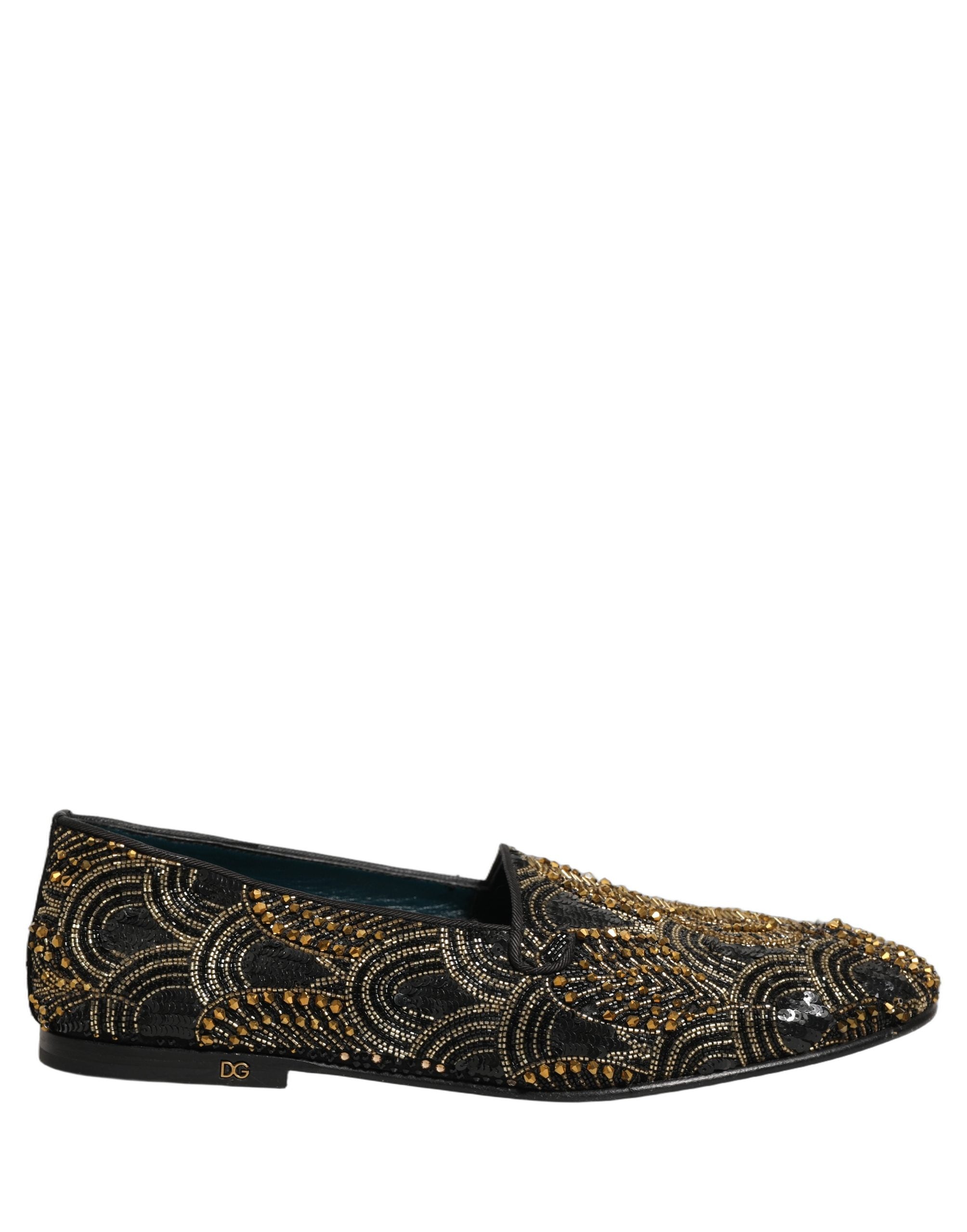 Chaussures Dolce & Gabbana noires à ornements dorés, élégantes mocassins à enfiler avec détails scintillants.