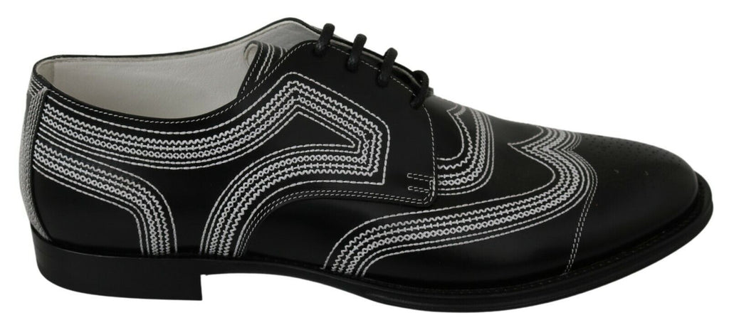 Chaussures Derby noires en cuir Dolce & Gabbana avec lacets blancs pour homme, style formel et élégant.