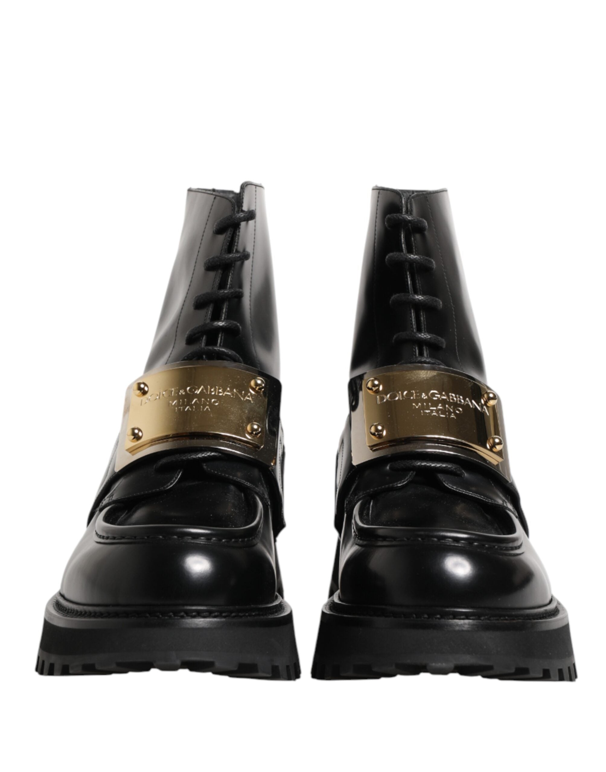Bottes en cuir noir Dolce & Gabbana avec plaque DG, lacets et semelle robuste, mode élégante et sophistiquée.