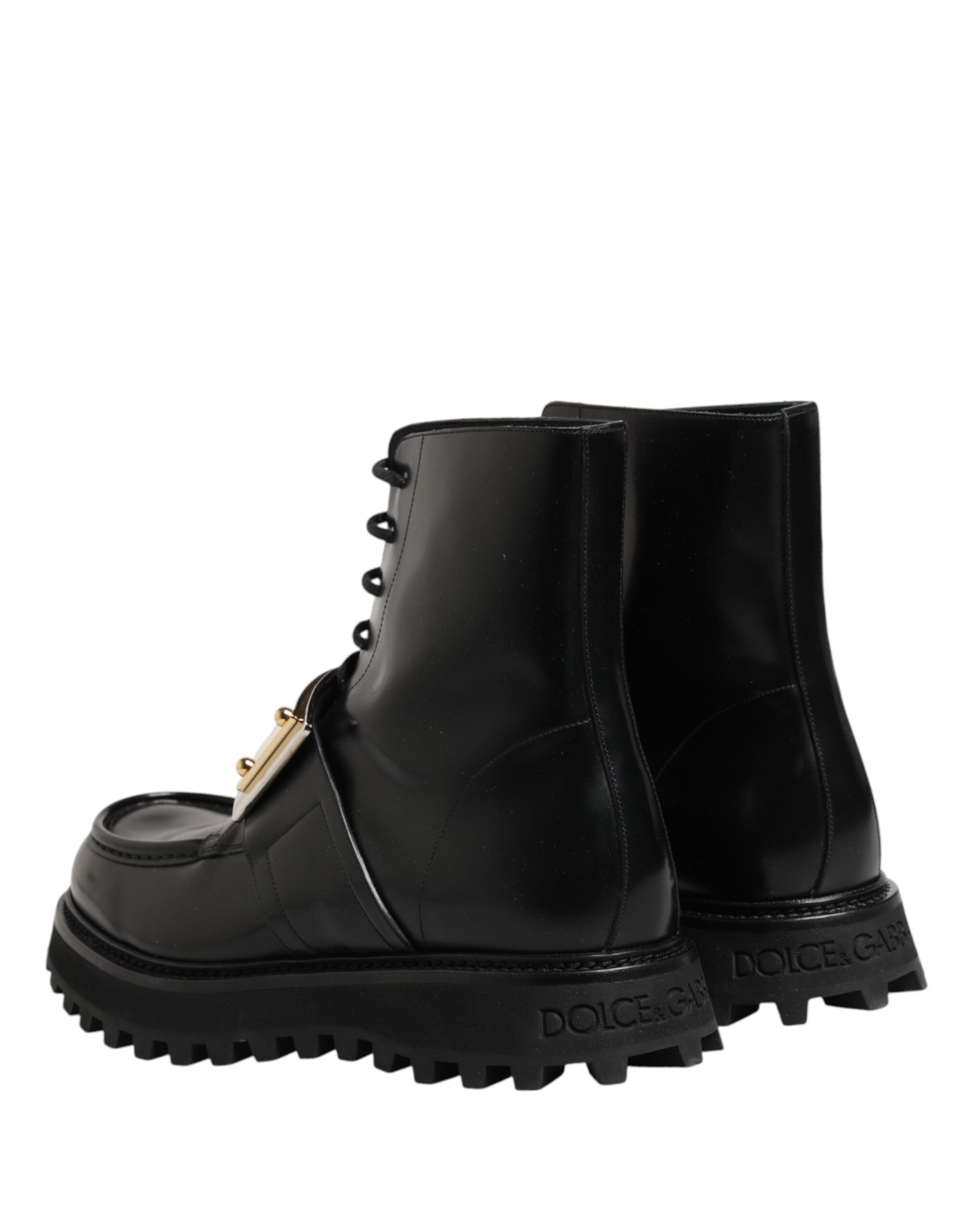 Bottes noires en cuir Dolce & Gabbana avec plaque DG, lacets, style élégant et sophistiqué.