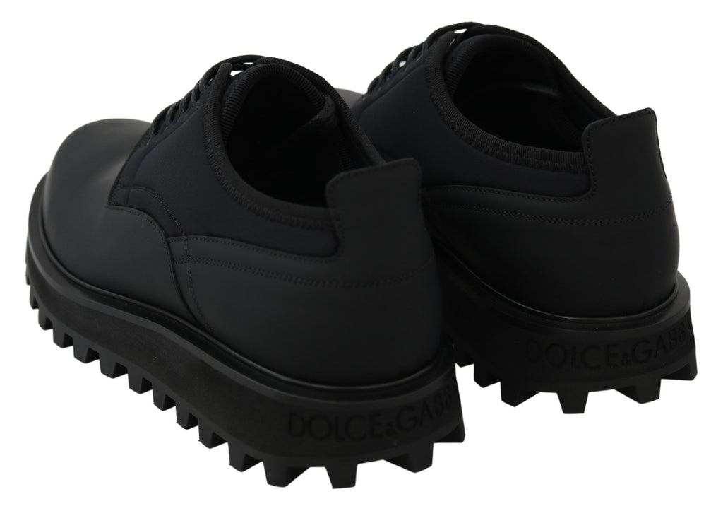 Chaussures Derby chunky en caoutchouc noir en cuir de veau de Dolce & Gabbana, style robuste et moderne.