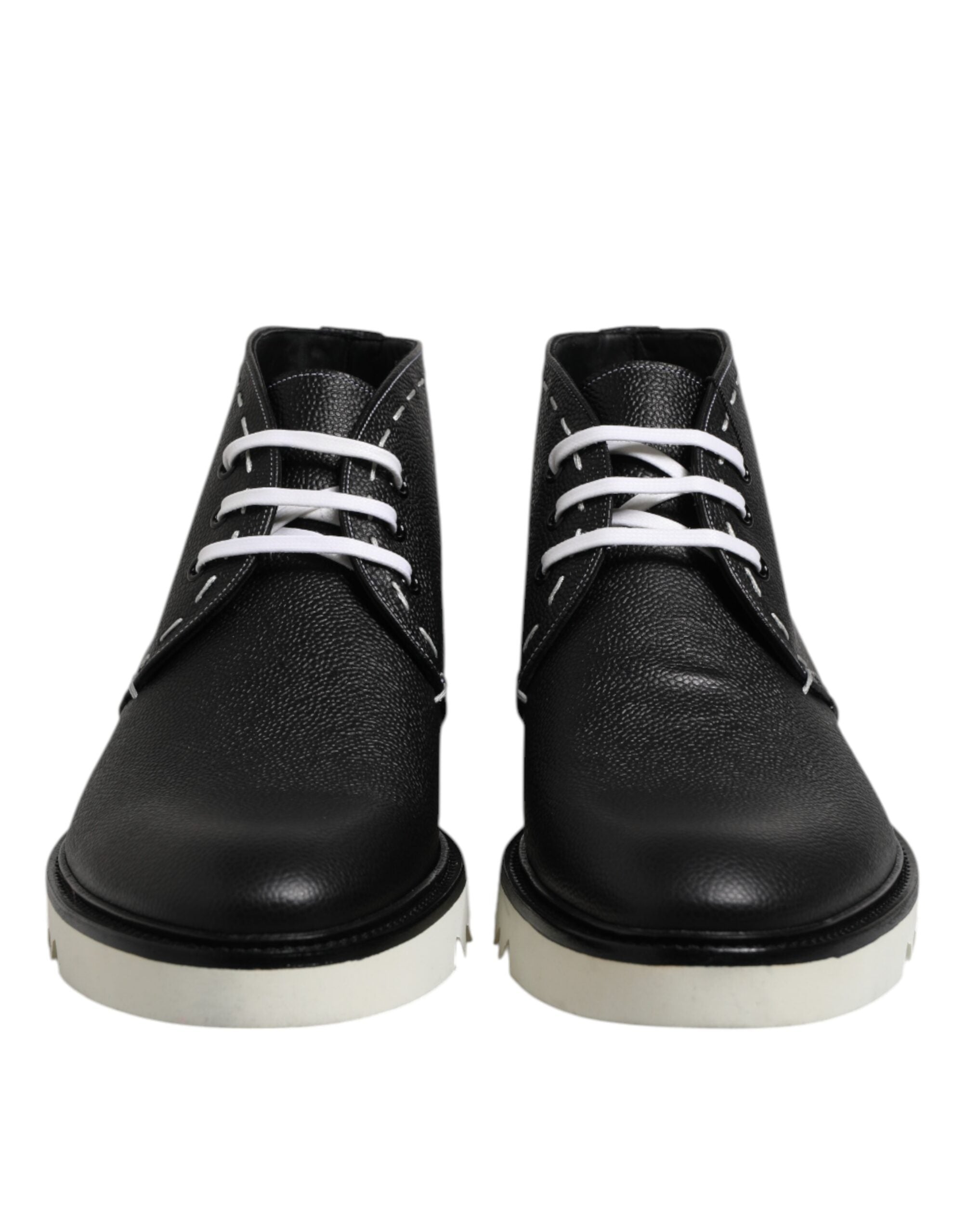 Bottes ankle en cuir noir et blanc de Dolce & Gabbana, chaussures élégantes avec détails sophistiqués.