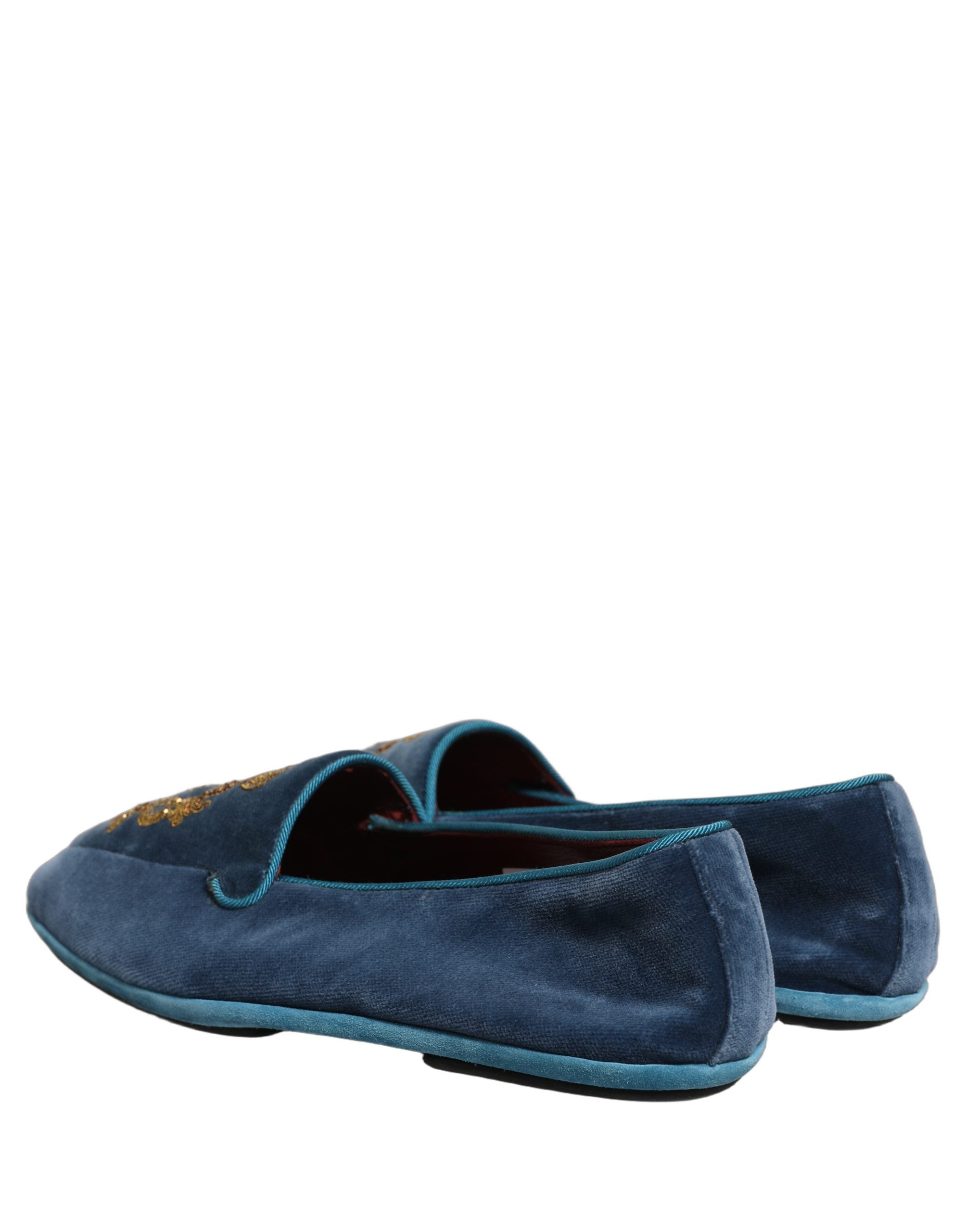 Chaussures loafers Dolce & Gabbana en velours bleu avec broderie de couronne, élégantes et sophistiquées pour homme.