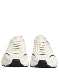 Chaussures sneakers basses Dolce & Gabbana Daymaster en blanc et noir, modèles décontractés pour homme.