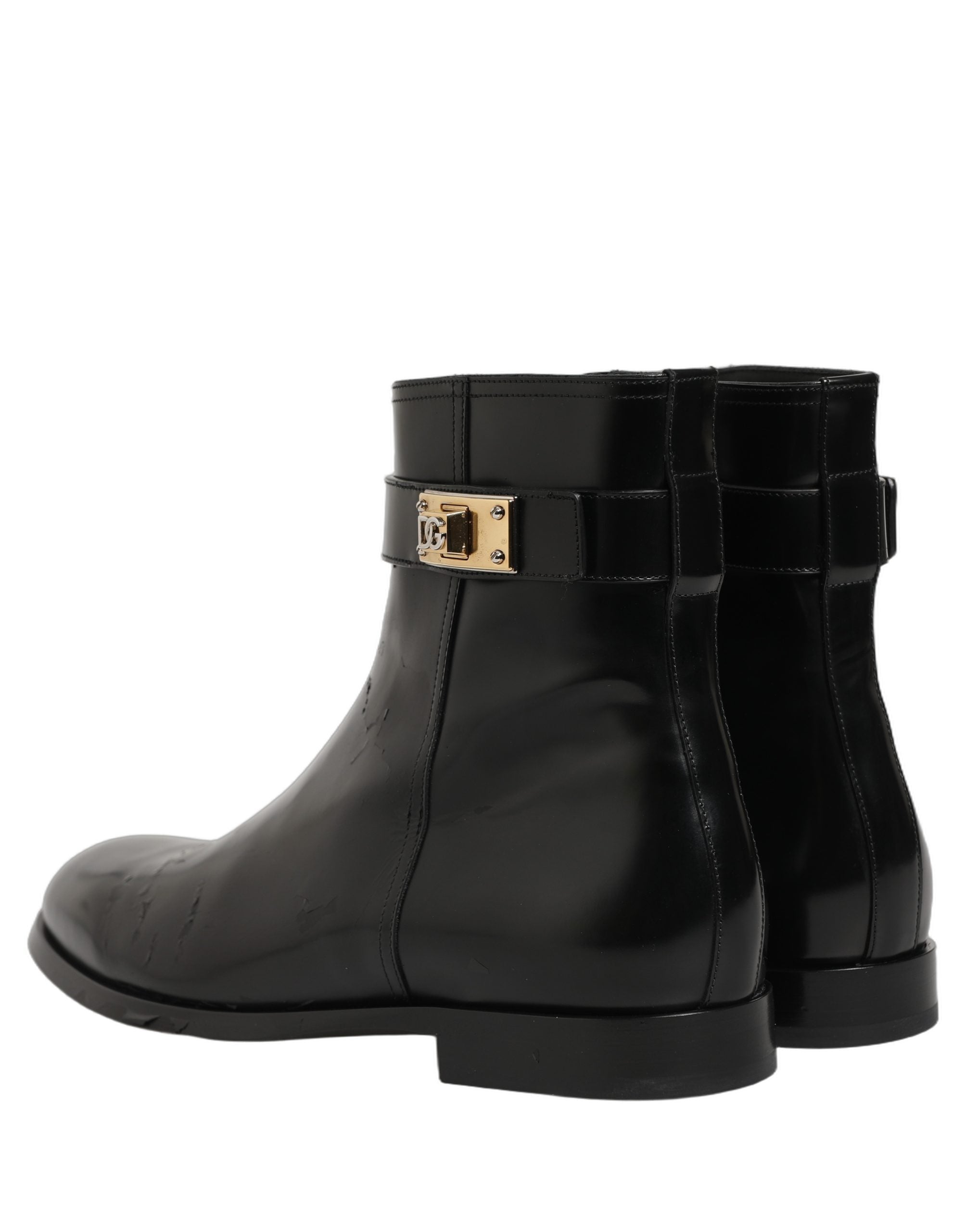 Bottes en cuir noir Dolce & Gabbana avec boucle logo, mi-mollet, pour homme, style élégant et sophistiqué.