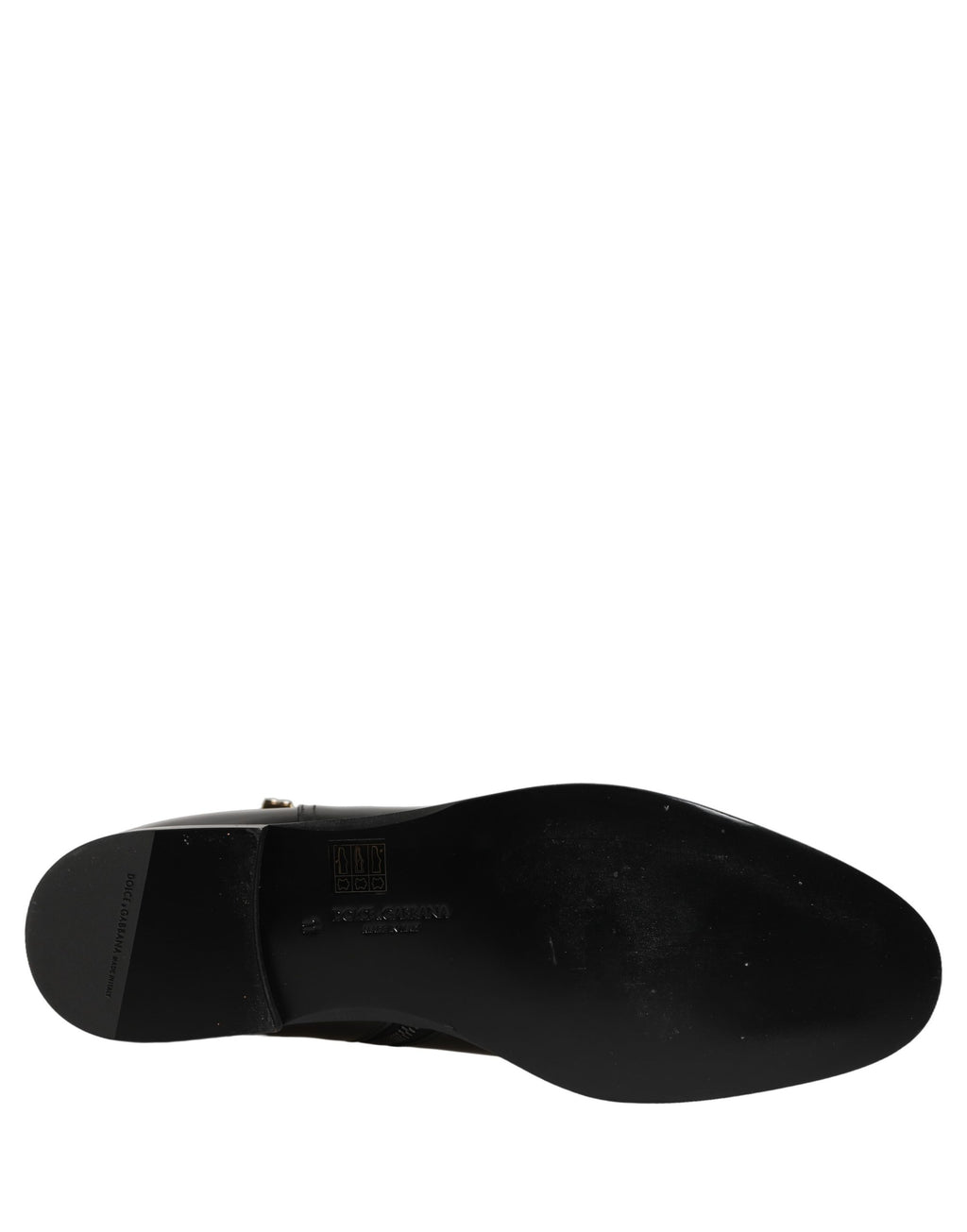 Bottes mi-mollet en cuir noir Dolce & Gabbana avec boucle logo, style élégant et sophistiqué, visibles en détail.