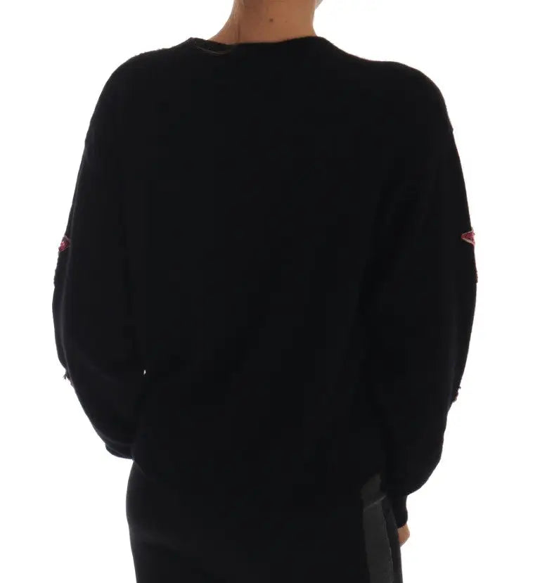 Pull en cachemire noir dolce et gabbana avec patchs rouges brodés discrets sur les manches