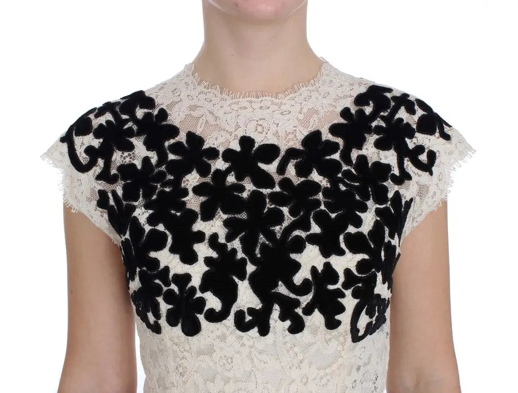 Robe longue en dentelle ivoire avec applications florales en velours noir de dolce & gabbana