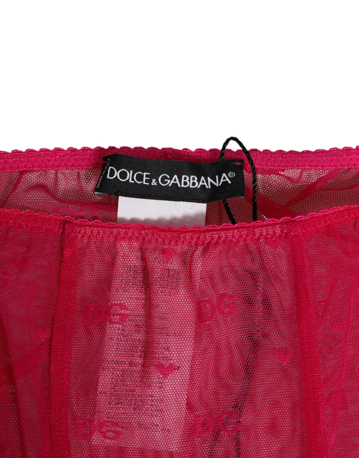 Pantalon midi en dentelle fuchsia dolce gabbana avec motif brodé dg et étiquette de marque