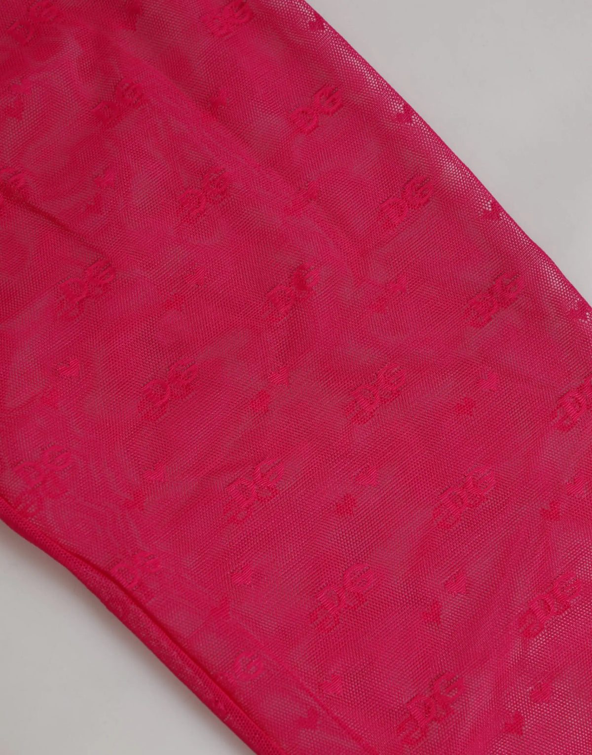 Legging dolce & gabbana en dentelle nylon fuchsia transparent avec motif subtil répété