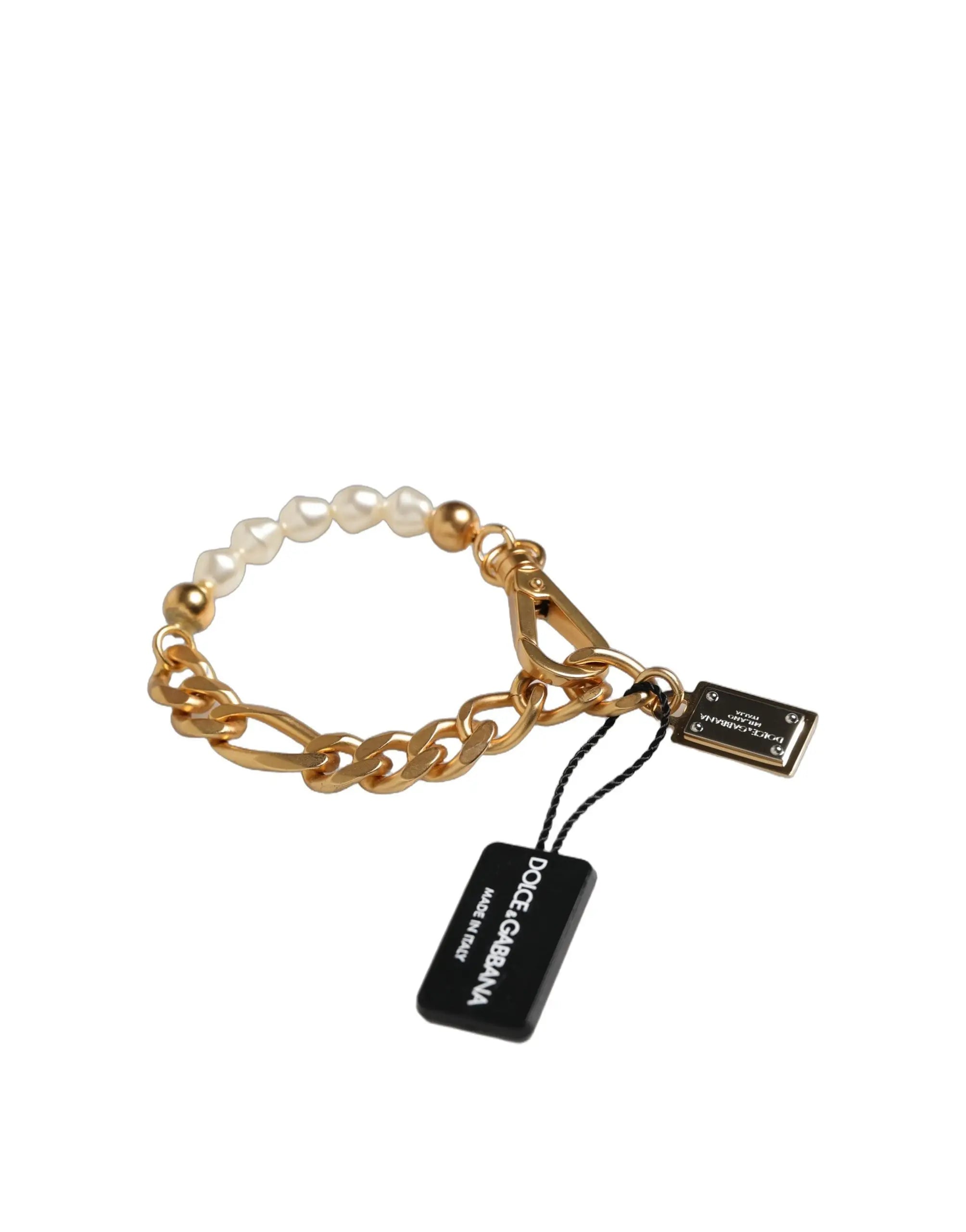 Bracelet chaîne en laiton doré dolce gabbana orné de perles blanches et de perles dorées avec étiquette de marque