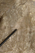 Dentelle délicate dorée avec base translucide et motifs floraux pour la robe mini fourreau ligne a dolce & gabbana