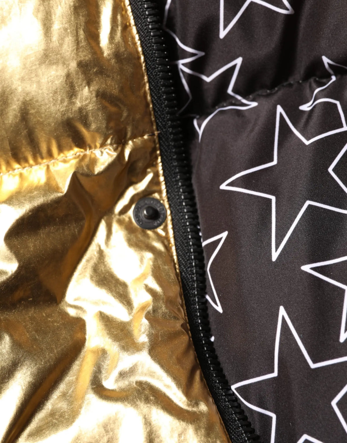 Dolce & gabbana veste matelassée dorée avec capuche et doublure noire à motif étoiles en tissu métallisé