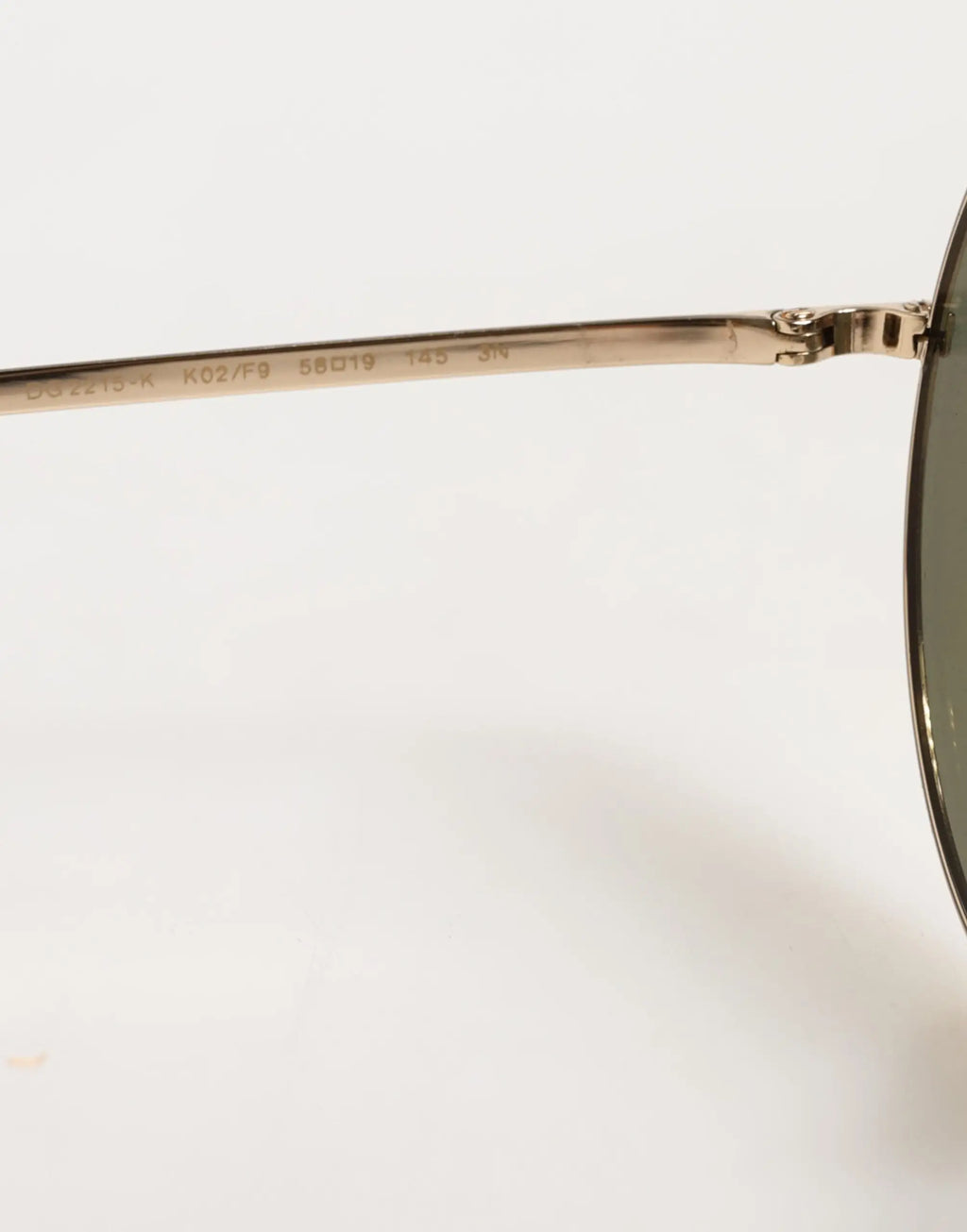 Lunettes de soleil dolce & gabbana en métal doré avec monture ronde et verres foncés modernes