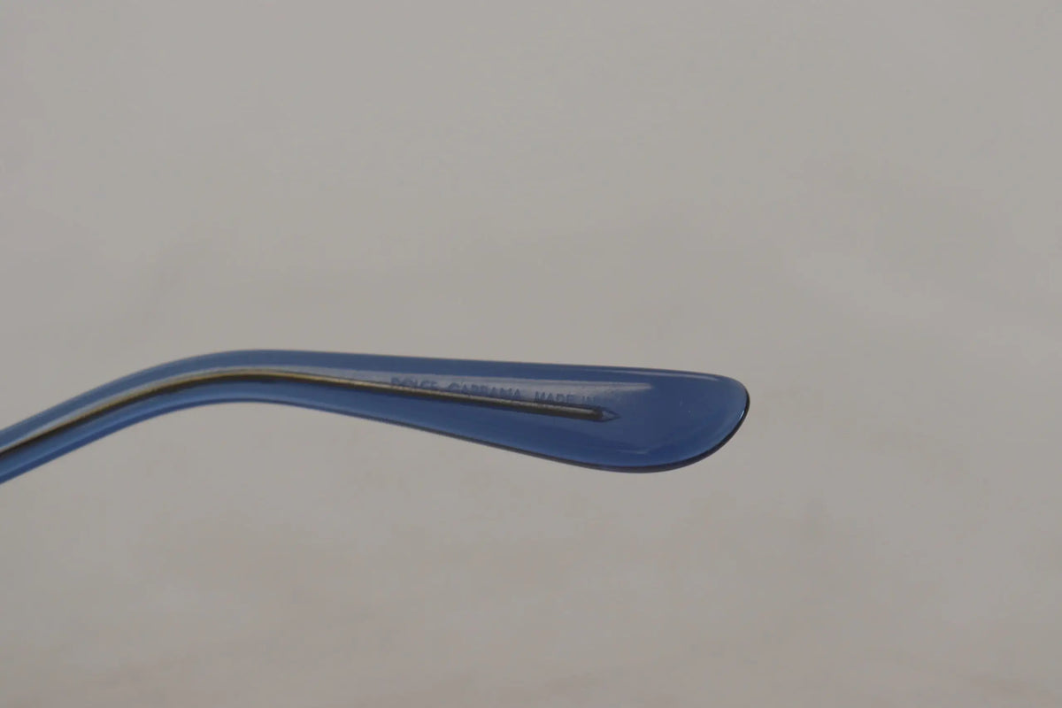Embout bleu en plastique à larrière des lunettes de soleil dolce & gabbana or oval métal cristaux dg2209b