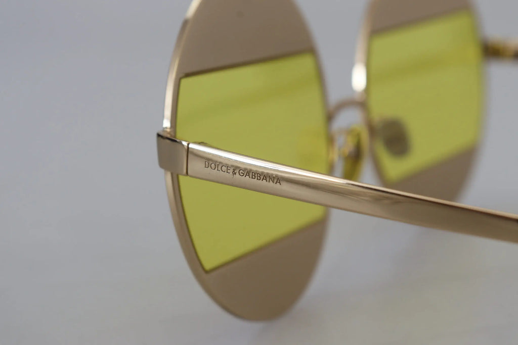 Lunettes de soleil dolce & gabbana dg2209b en métal doré avec verres ovales jaunes vibrants et design minimaliste