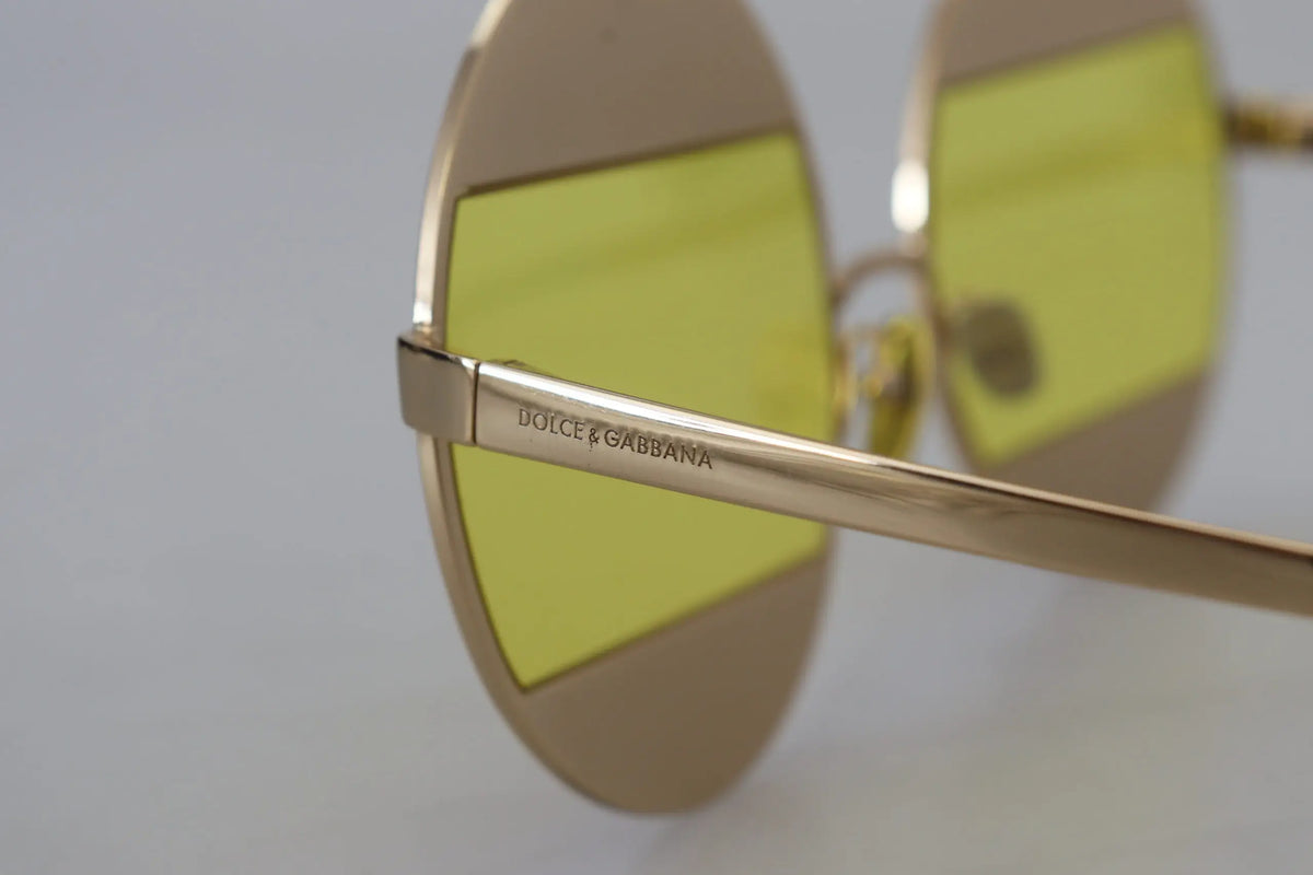 Lunettes de soleil dolce & gabbana dg2209b en métal doré avec verres ovales jaunes vibrants et design minimaliste